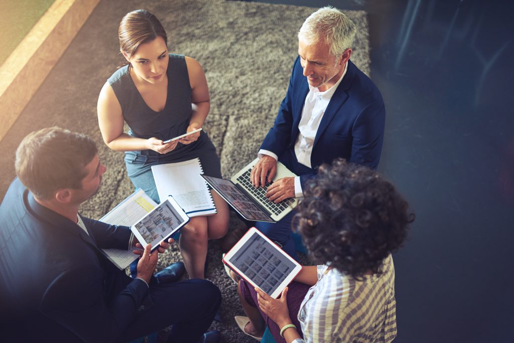 Business people using personal devices